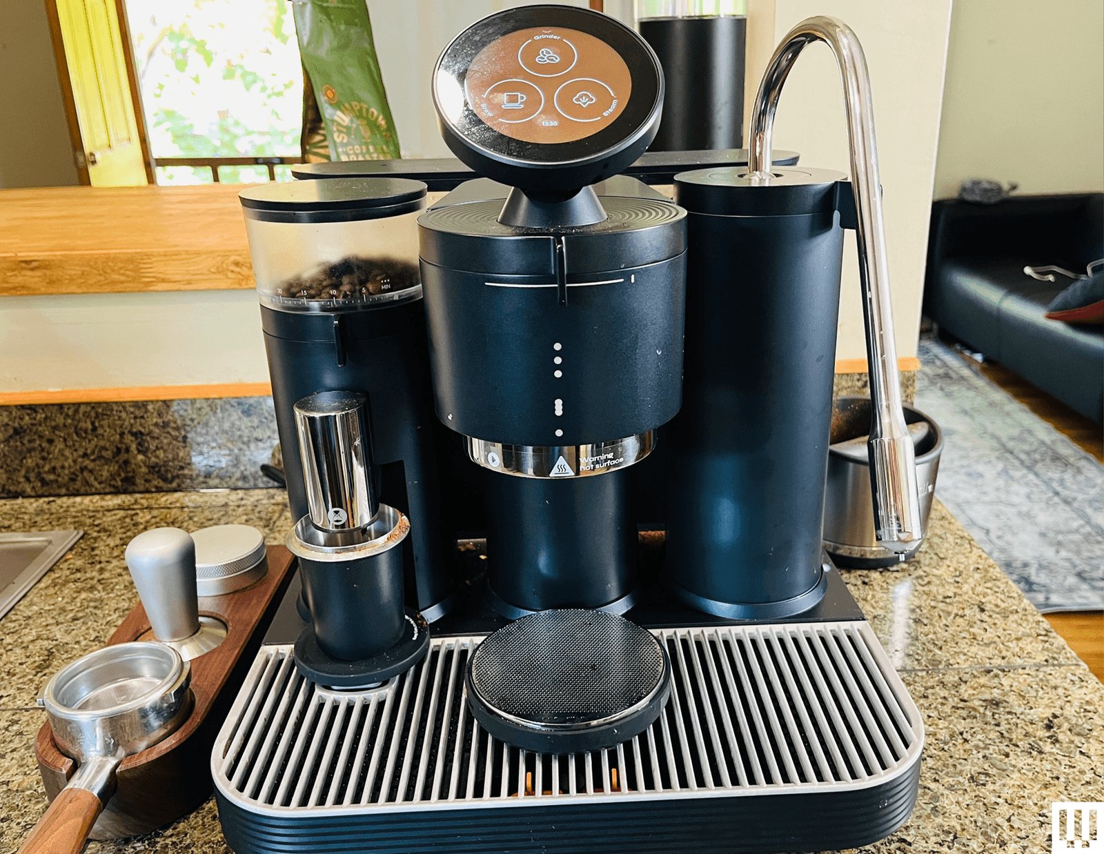 Carefully leveling coffee grounds into the metal filter basket for home espresso.