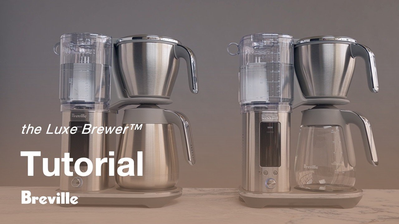 Pouring filtered water into the reservoir of a new home coffee maker.